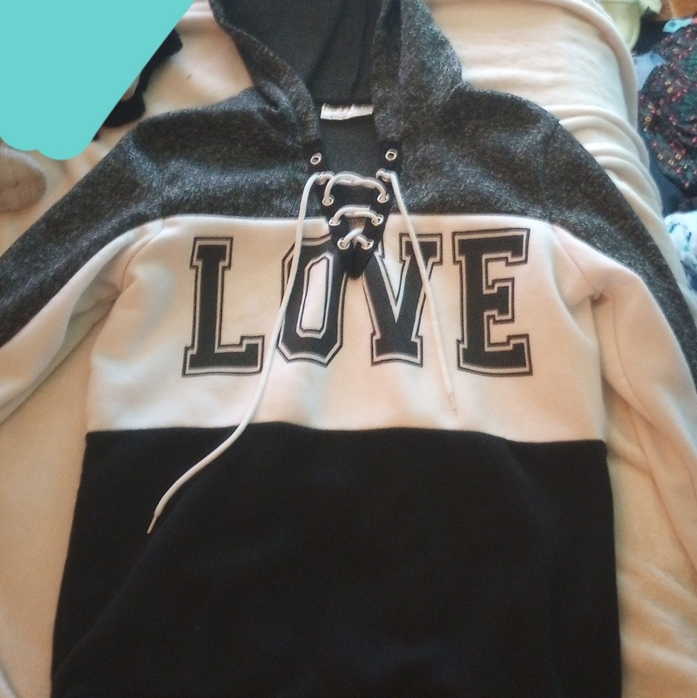Black and white hoodie with the word love